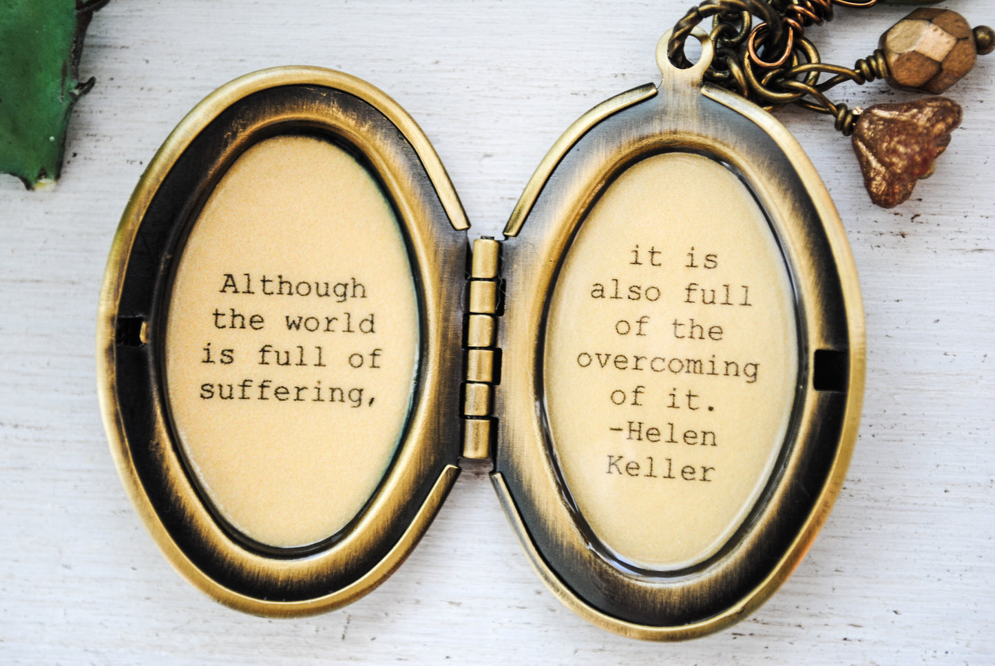 Although the world is full of suffering it is also full of overcoming of it Helen Keller - Quote Locket